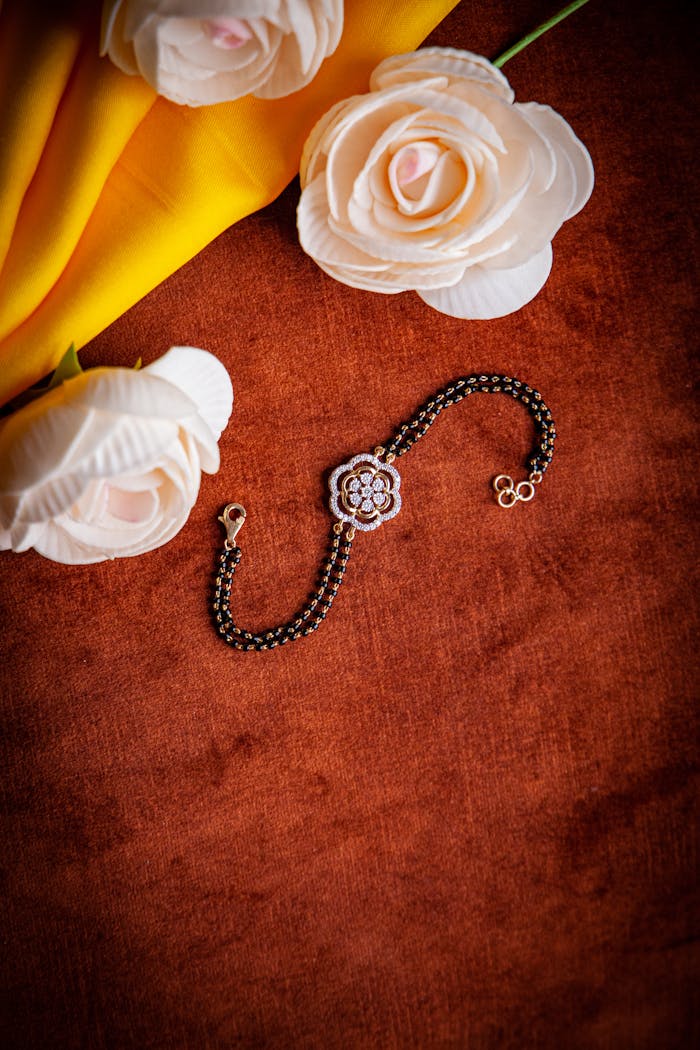 Stylish floral bracelet displayed on velvet with soft fabric and artificial roses.